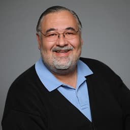 Headshot of John Goldin Mertdogan, MD